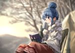  1girl blue_hair blurry blurry_background book brown_eyes commentary cup eyebrows_visible_through_hair fingerless_gloves gloves hair_bun highres outdoors reading shawl shima_rin sitting solo steam tree_bowbow yurucamp 