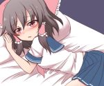  1girl bed black_hair blue_skirt blush bow hair_bow hair_tubes hakurei_reimu lying neckerchief on_bed pillow pleated_skirt red_bow red_eyes red_neckwear school_uniform serafuku shiohachi skirt solo touhou 