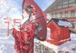  1girl absurdres bare_tree blush bow brown_eyes brown_hair floral_print flower hair_bow hair_flower hair_ornament highres japanese_clothes jiao kimono long_hair looking_at_viewer original outdoors over_shoulder parasol red_kimono red_umbrella scarf shrine snow snowing standing torii tree umbrella very_long_hair white_scarf wide_sleeves 