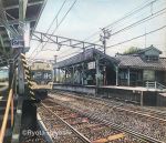  antennae artist_name colored_pencil_(medium) commentary ground_vehicle hayashi_ryouta no_humans original outdoors power_lines railing railroad_tracks real_world_location scenery sign sky stairs telephone_pole traditional_media train train_station train_station_platform tree 