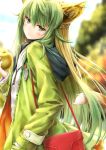  1girl ahoge animal_ears atalanta_(fate) bag bangs blonde_hair blouse blurry blurry_background blush breasts casual cat_ears cat_tail coat commentary_request day eyebrows_visible_through_hair fate/apocrypha fate_(series) food fruit green_coat green_eyes green_hair green_nails hair_between_eyes hand_in_pocket handbag head_tilt highres holding holding_fruit hood hood_down hooded_coat long_hair looking_at_viewer multicolored_hair nail_polish neck_ribbon outdoors ribbon sidelocks solo suien tail two-tone_hair very_long_hair white_blouse 