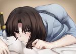  1girl bed_sheet blue_kimono blush brown_background brown_eyes brown_hair highres japanese_clothes kara_no_kyoukai kimono knife looking_at_viewer lying okakasushi on_stomach ryougi_shiki short_hair solo 