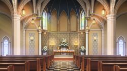  arched_window ceiling_light chandelier checkered_floor church flower glowing highres indoors no_humans non-web_source official_art our_life:_beginnings_and_always pew plant potted_plant scenery stained_glass table white_flower window 