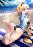  1girl absurdres ass barefoot beach black_hairband black_scrunchie black_swimsuit blonde_hair blue_eyes blue_hoodie blush braid clouds fate/grand_order fate_(series) hair_ornament hair_scrunchie hairband hane_yuki highres jeanne_d&#039;arc_(fate)_(all) jeanne_d&#039;arc_(swimsuit_archer) long_hair looking_at_viewer lying scrunchie sky smile solo sweat swimsuit toes towel 