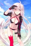  1girl antenna_hair ass_visible_through_thighs bangs beach bikini black_bikini black_gloves blue_sky blurry blurry_background blush breasts brown_eyes cleavage clouds collarbone commentary_request day depth_of_field fate/grand_order fate_(series) gloves halterneck hand_on_own_knee hand_up jeanne_d&#039;arc_(alter_swimsuit_berserker) jeanne_d&#039;arc_(fate)_(all) large_breasts leaning_forward leg_belt legs_apart looking_at_viewer m-ya navel o-ring o-ring_top ocean outdoors parted_lips red_legwear shrug_(clothing) single_thighhigh sky solo standing swimsuit teeth thigh-highs twitter_username water white_hair 