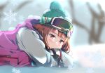  1girl absurdres aqua_hat bangs bare_tree blunt_bangs blurry blurry_background blush brown_hair coat day gloves goggles goggles_on_head highres hood hood_down lying on_stomach original outdoors pink_coat pout red_eyes snow snow_on_body snow_on_head snowflakes solo tree user_eshu4854 