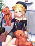 1girl abigail_williams_(fate/grand_order) bangs bare_shoulders beret black_bow black_hat black_shirt black_shorts blonde_hair blue_eyes blush bow bracelet breasts closed_mouth collarbone fate/grand_order fate_(series) forehead hair_bow hat highres holding holding_stuffed_animal indoors jewelry long_hair looking_at_viewer off_shoulder orange_bow parted_bangs plant potted_plant shiguru shirt shorts sitting sleeves_past_fingers sleeves_past_wrists small_breasts solo stuffed_animal stuffed_toy teddy_bear thighs 