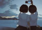  2girls beach brown_hair camera highres multiple_girls school_uniform seifuku short_hair sky smile sunset takamichi water 