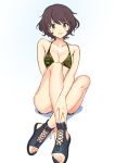  1girl akiyama_yukari bangs between_legs bikini bikini_shorts black_footwear breasts brown_eyes brown_hair camouflage camouflage_bikini cleavage closed_mouth collarbone commentary full_body girls_und_panzer green_bikini hand_between_legs legs legs_crossed light_blush lips looking_at_viewer medium_breasts messy_hair open_toe_shoes sandals short_hair shorts simple_background sitting smile solo swimsuit ukamaru white_background 