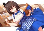  1girl alternate_costume apron baguette basket black_hair blue_apron blue_neckwear blue_skirt blurry blurry_background blush bread breasts dutch_angle eyebrows_visible_through_hair food hair_between_eyes hair_ornament hand_up highres holding kantai_collection kerchief kinona kobeya koubeya_uniform looking_at_viewer medium_breasts medium_hair neck_ribbon open_mouth parted_lips plaid plaid_apron pocket red_eyes ribbon shirt short_sleeves skirt smile solo standing tongs waitress white_shirt yamashiro_(kantai_collection) 