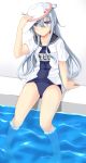  1girl adjusting_clothes adjusting_hat ass_visible_through_thighs barefoot blue_eyes blue_sailor_collar blue_swimsuit blush collarbone eyebrows_visible_through_hair flat_cap from_below full_body hair_between_eyes hammer_and_sickle hat hibiki_(kantai_collection) highres kantai_collection long_hair long_sleeves looking_at_viewer name_tag old_school_swimsuit one-piece_swimsuit open_clothes open_shirt outdoors peaked_cap pool poolside remodel_(kantai_collection) sailor_collar school_swimsuit school_uniform senekio shirt silver_hair simple_background sitting smile soaking_feet solo star swimsuit swimsuit_under_clothes verniy_(kantai_collection) wading water white_background white_hat white_shirt 