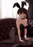  1girl alternate_costume animal_ears bare_shoulders black_leotard bow bowtie brown_eyes brown_hair bunny_girl bunny_tail bunnysuit couch detached_collar fake_animal_ears fuyube_gin_(huyube) hairband highres indoors kaga_(kantai_collection) kantai_collection leotard looking_at_viewer on_couch pantyhose rabbit_ears side_ponytail solo strapless strapless_leotard tail wrist_cuffs 