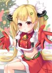  1girl :o ahoge azur_lane bangs belt belt_buckle black_panties blonde_hair blush box buckle capelet christmas christmas_ornaments christmas_tree commentary_request eldridge_(azur_lane) eyebrows_visible_through_hair facial_mark fur-trimmed_capelet fur-trimmed_gloves fur-trimmed_skirt fur_trim gift gift_box gloves green_belt groin hair_ornament highleg highleg_panties highres long_hair looking_at_viewer navel panties parted_lips red_capelet red_eyes red_gloves red_skirt santa_costume sitting skirt solo tsukiman twintails underwear very_long_hair 