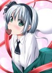  1girl ascot bangs black_hairband black_neckwear black_ribbon blush breasts chocolate chocolate_heart commentary_request cowboy_shot eyebrows_visible_through_hair food_in_mouth green_eyes green_skirt green_vest hair_between_eyes hair_ribbon hairband heart highres hitodama konpaku_youmu konpaku_youmu_(ghost) leaning_forward lens_flare long_sleeves looking_at_viewer medium_breasts mouth_hold nori_tamago nose_blush off_shoulder pink_background pleated_skirt red_ribbon revision ribbon shirt short_hair silver_hair skirt skirt_set solo touhou vest white_shirt 