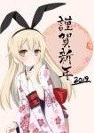  1girl 2019 alternate_costume black_hairband blonde_hair blush brown_eyes closed_mouth eyebrows_visible_through_hair finger_to_mouth floral_print hairband happy_new_year japanese_clothes kantai_collection kimono long_hair looking_at_viewer misato_(aka_misato) new_year obi pink_background print_kimono sash shimakaze_(kantai_collection) smile solo translated white_kimono 