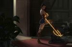  1boy 1girl after_battle armlet ass asymmetrical_hair bare_shoulders black_hair book bound bracer bullet_hole carpet dc_comics desk door doorway glowing glowing_weapon greaves gun handgun highres kneehighs kneeling lasso lasso_of_truth long_hair looking_at_viewer lucia_hsiang messy_room open_door paper plant platform_footwear platform_heels shadow skirt stepping superhero tiara weapon wonder_woman wonder_woman_(series) 