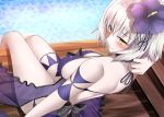  1girl bare_shoulders blush bow eyebrows_visible_through_hair fate/grand_order fate_(series) flower hair_between_eyes hair_flower hair_ornament jeanne_d&#039;arc_(alter)_(fate) jeanne_d&#039;arc_(fate)_(all) looking_back purple_swimsuit shirosuzu short_hair sitting solo swimsuit water white_hair yellow_eyes 