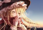  1girl bangs black_coat blonde_hair bow braid breath coat covering_mouth day eyebrows_behind_hair eyelashes face fingernails floating_hair frills gradient_sky hair_between_eyes hands_up hat hat_bow highres kirisame_marisa light_blush long_hair looking_ahead outdoors red_scarf scarf side_braid single_braid sky sleeves_past_wrists solo torinari_(dtvisu) touhou white_bow winter_clothes witch_hat yellow_eyes 
