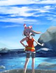  1girl bike_shorts black_shorts blue_sky bow brown_hair clouds creatures_(company) day floating_hair game_freak hair_bow hairband haruka_(pokemon) highres holding holding_poke_ball long_hair nintendo outdoors outstretched_arm poke_ball pokemon pokemon_(game) pokemon_oras red_hairband shirt short_shorts shorts shorts_under_shorts sky sleeveless sleeveless_shirt solo standing striped striped_bow white_shirt white_shorts wristband yuihiko 