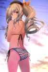  1girl ass beret bikini black_hat clouds commentary_request from_behind gradient_sky grey_eyes hat kantai_collection kashima_(kantai_collection) looking_at_viewer looking_back power_lines side-tie_bikini sidelocks silver_hair sky solo striped striped_bikini sunset swimsuit tsurime twintails wavy_hair yumesato_makura 