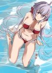  1girl ahoge barefoot bikini breasts cleavage frilled_bikini frills from_above hair_ornament hair_scrunchie large_breasts long_hair looking_at_viewer low_twintails lyrical_denko navel partially_submerged purple_hair red_bikini scrunchie senki_zesshou_symphogear solo swimsuit twintails very_long_hair water yukine_chris 