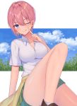  1girl bangs bare_legs blue_eyes blush breasts brown_footwear cleavage clouds commentary_request eyebrows_visible_through_hair finger_to_face go-toubun_no_hanayome green_skirt hair_between_eyes highres izumo_neru large_breasts looking_at_viewer nakano_ichika one_eye_closed pink_hair shirt short_hair short_sleeves sitting skirt smile socks solo tongue tongue_out white_footwear white_shirt 