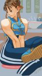  1girl alternate_costume breasts brown_eyes brown_hair capcom chun-li closed_mouth commentary_request double_bun earrings highres jewelry seven77 short_hair sitting solo street_fighter street_fighter_zero_(series) unitard 