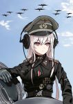  1girl absurdres aircraft airplane belt chinese_commentary choker commentary_request girls_frontline gloves hat headphones highres iron_cross kar98k_(girls_frontline) long_hair military military_hat military_uniform pk-971 red_eyes silver_hair sky solo throat_microphone uniform upper_body 