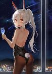  1girl :o absurdres arched_back ass ayanami_(azur_lane) azur_lane back backless_outfit backlighting bangs bare_arms bare_shoulders black_leotard breasts brown_legwear bunny_girl bunny_tail bunnysuit city_lights cocktail_glass cowboy_shot cup drink drinking_glass from_behind glint hair_ornament headgear highres holding holding_cup indoors leotard long_hair looking_at_viewer looking_back meteor_shower night night_sky open_mouth pantyhose ponytail red_eyes refile sidelocks silver_hair sky small_breasts solo standing star_(sky) starry_sky tail 