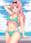  1girl :d arm_support arm_up bangs bare_arms bare_shoulders bikini black_bow blue_eyes blue_sky blunt_bangs blush bow breasts cleavage clouds cloudy_sky collarbone commentary day english_commentary eyebrows_visible_through_hair fast-runner-2024 frilled_bikini frills fujiwara_chika green_bikini hair_bow hand_behind_head highres horizon kaguya-sama_wa_kokurasetai_~tensai-tachi_no_renai_zunousen~ large_breasts long_hair looking_at_viewer navel ocean open_mouth outdoors pink_hair round_teeth sky smile solo swimsuit teeth upper_teeth very_long_hair water watermark web_address 