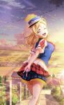  1girl ;d blonde_hair blue_headwear blue_shorts braid clouds crown_braid day gloves hat head_tilt index_finger_raised lens_flare long_hair looking_back love_live! love_live!_sunshine!! miniskirt ohara_mari one_eye_closed open_mouth outdoors peaked_cap pleated_skirt print_shirt red_skirt shirt short_shorts short_sleeves shorts shorts_under_skirt skirt sky smile solo stairs standing striped striped_shorts white_gloves white_shirt yellow_eyes 