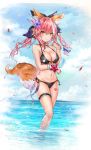  1girl animal_ear_fluff animal_ears bare_arms bare_legs bare_shoulders bikini black_bikini black_choker blue_flower blue_ribbon blue_sky breasts bubble choker cleavage clouds cloudy_sky collarbone day fang fate/grand_order fate_(series) flower food hair_flower hair_ornament halter_top halterneck hand_up highres holding holding_food horizon large_breasts leg_garter long_hair looking_at_viewer luminous navel ocean outdoors petals pink_hair popsicle ribbon side-tie_bikini sky smile solo standing star stomach swimsuit tail tamamo_(fate)_(all) tamamo_no_mae_(fate) thighs twintails wading water wristband yellow_eyes 