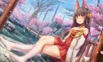  1girl :o animal_ear_fluff animal_ears architecture azur_lane bare_shoulders bare_tree black_hair blue_sky blush cherry_blossoms choker collarbone commentary_request day dress dutch_angle east_asian_architecture hair_ornament highres kneehighs legs_crossed long_hair long_sleeves looking_at_viewer nagato_(azur_lane) no_shoes off_shoulder outdoors parted_lips petals pleated_dress red_dress rock shrine sidelocks sitting sky solo thighs tree water white_legwear yellow_eyes yu_ni_t 