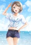  1girl ;d absurdres arm_up bangs belt belt_buckle blue_eyes blue_shorts blue_sky blush breasts brown_belt brown_hair buckle clouds cloudy_sky collarbone commentary_request day eyebrows_visible_through_hair highres horizon love_live! love_live!_sunshine!! midriff ocean one_eye_closed open_mouth outdoors print_shirt round_teeth salute shirt short_shorts short_sleeves shorts sin_(sin52y) sky small_breasts smile solo t-shirt teeth thigh_gap tied_shirt upper_teeth watanabe_you water water_drop white_shirt wide_sleeves 