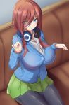  1girl bangs black_legwear blue_cardigan blue_eyes blush breasts brown_hair collared_shirt commentary_request couch dress_shirt eyebrows_visible_through_hair eyes_visible_through_hair go-toubun_no_hanayome green_skirt hair_between_eyes hair_over_one_eye headphones headphones_around_neck highres j_yak47 large_breasts long_hair long_sleeves looking_at_viewer nakano_miku pantyhose pleated_skirt shirt skirt solo white_shirt 