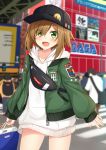  1girl :d akihabara bag bangs baseball_cap black_headwear blurry blurry_background blush brand_name_imitation brown_hair commentary_request depth_of_field eyebrows_visible_through_hair eyes_visible_through_hair fang fingernails green_eyes green_jacket hair_over_one_eye haru_(komori_kuzuya) hat highres holding holding_bag hood hood_down hoodie jacket komori_kuzuyu long_hair long_sleeves looking_at_viewer open_clothes open_jacket open_mouth original outdoors sega shopping_bag sleeves_past_wrists smile solo_focus white_hoodie 