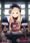  1girl abigail_williams_(fate/grand_order) bangs black_bow black_headwear blonde_hair blue_eyes bow cake dress fate/grand_order fate_(series) flesh food fork fruit hair_bow hat highres indoors knife long_hair long_sleeves looking_at_viewer open_mouth orange_bow pancake parted_bangs plate polka_dot polka_dot_bow popuru sleeves_past_fingers sleeves_past_wrists solo strawberry stuffed_animal stuffed_toy table teddy_bear very_long_hair window wooden_table 