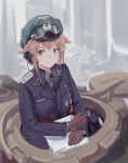  1girl blonde_hair blue_eyes commentary cupola english_commentary gloves goggles goggles_on_headwear ground_vehicle hat headphones highres iron_cross map medal military military_hat military_vehicle motor_vehicle original short_hair solo tank throat_microphone tuzik10 uniform world_war_ii 