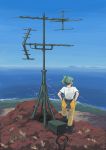  1girl antennae black_footwear blue_sky boots bow clear_sky cliff clothes_around_waist device from_behind grass green_bow green_hair hair_bow hands_on_hips highres horizon island kantai_collection knee_up looking_afar looking_to_the_side machine ocean outdoors pants ponytail radio_antenna scenery shirt shoes shore sidelocks sky solo standing t-shirt vent_arbre white_shirt wire yellow_pants yuubari_(kantai_collection) 