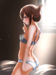  1girl ass blue_bra blue_panties bra breasts brown_eyes brown_hair closed_mouth commentary_request folded_ponytail hair_between_eyes highres inazuma_(kantai_collection) kantai_collection long_hair looking_at_viewer panties sitting small_breasts smile solo sunlight tama_(seiga46239239) underwear window 
