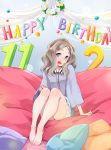  1girl barefoot birthday blue_eyes blush chibikko_(morihito) eyebrows feet full_body happy_birthday highres light_brown_hair long_hair morihito open_mouth original pillow shirt shorts solo thick_eyebrows thighs 