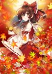  1girl autumn_leaves blush bow brown_eyes brown_hair detached_sleeves eyebrows_visible_through_hair frilled_bow frilled_hair_tubes frills hair_between_eyes hair_bow hair_tubes hakurei_reimu kirisita leaf long_hair long_skirt long_sleeves maple_leaf midriff multicolored_hair print_bow red_bow red_shirt red_skirt ribbon-trimmed_skirt ribbon-trimmed_sleeves ribbon_trim sailor_collar shirt silver_hair skirt sleeveless sleeveless_shirt solo standing touhou two-tone_hair white_sailor_collar white_sleeves wide_sleeves 