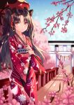  1girl absurdres black_bow bow bridge brown_eyes brown_hair cherry_blossoms cherry_tree collarbone day earrings eyebrows_visible_through_hair fate/grand_order fate_(series) floating_hair hair_between_eyes hair_bow hair_ribbon highres holding holding_umbrella ishtar_(fate/grand_order) japanese_clothes jewelry kimono long_hair long_sleeves looking_at_viewer outdoors print_kimono red_kimono red_ribbon red_umbrella ribbon shaffelli solo standing torii twintails umbrella very_long_hair wide_sleeves yukata 