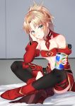  1girl absurdres bare_shoulders black_legwear blonde_hair blush boots braid breasts can commentary_request detached_sleeves fate/grand_order fate_(series) green_eyes hair_ornament hair_scrunchie highres jun_(540000000000000) long_hair looking_at_viewer mordred_(fate) mordred_(fate)_(all) navel on_bed ponytail red_footwear red_scrunchie red_sleeves scrunchie sitting small_breasts solo thigh-highs 