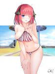  1girl ;p absurdres artist_name ass_visible_through_thighs bangs bare_shoulders bikini black_ribbon blue_eyes blunt_bangs blush breasts collarbone da-cart day eyebrows_visible_through_hair go-toubun_no_hanayome hair_ornament hair_ribbon hand_on_own_thigh highres large_breasts leaning_forward looking_at_viewer nakano_nino navel one_eye_closed outdoors redhead ribbon signature smile solo standing swimsuit tongue tongue_out 