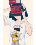  1girl black_hair camera commentary elliemaplefox english_commentary facing_viewer holding holding_camera original shirt short_hair short_sleeves simple_background solo t-shirt tan_background translated upper_body 