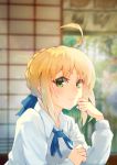 1girl absurdres ahoge artoria_pendragon_(all) blonde_hair blue_ribbon blurry blurry_background braided_bun closed_mouth collared_shirt fate/stay_night fate_(series) green_eyes hair_ribbon happymonk highres indoors long_sleeves looking_at_viewer neck_ribbon ribbon saber shirt short_hair sidelocks smile solo upper_body white_shirt wing_collar 