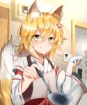  1girl animal_ear_fluff animal_ears apron bangs blonde_hair commentary eyebrows_visible_through_hair fox_ears fox_tail goodbyyyyyye hair_between_eyes hair_ornament highres indoors japanese_clothes ladle long_hair looking_at_viewer miko ribbon-trimmed_sleeves ribbon_trim senko_(sewayaki_kitsune_no_senko-san) sewayaki_kitsune_no_senko-san smile solo tail yellow_eyes 