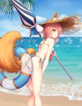  1girl absurdres animal_ear_fluff animal_ears beach beach_umbrella bikini blue_bikini blush breasts commentary commentary_request demis0ra eyebrows_visible_through_hair fate/grand_order fate_(series) fox_ears fox_girl fox_tail hat highres innertube large_breasts looking_at_viewer ocean outdoors palm_leaf palm_tree parasol pink_hair side-tie_bikini solo straw_hat summer swimsuit tail tamamo_(fate)_(all) tamamo_no_mae_(swimsuit_lancer)_(fate) tree umbrella yellow_eyes 