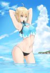  1girl adapted_costume ahoge ao_tsukushi armpits arms_behind_head bangs bare_shoulders bikini black_bikini_bottom black_ribbon blonde_hair cleavage_cutout clouds contrapposto day eyebrows_visible_through_hair fate/grand_order fate_(series) hair_between_eyes highres medium_hair mouth_hold navel ocean okita_souji_(fate) okita_souji_(fate)_(all) outdoors ribbon side-tie_bikini sky string_bikini swimsuit tankini tying_hair wading water yellow_eyes 